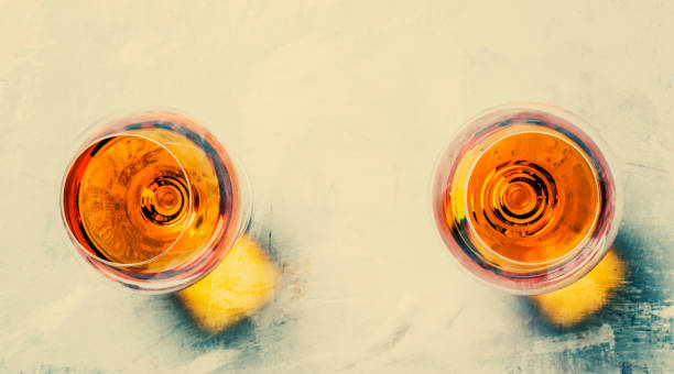 istock Strong alcoholic drink in two glasses, toned image, top view 827536738