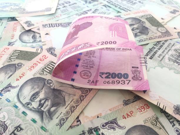 istock 2000 indian currency in forground with 100 currency in background 827536802