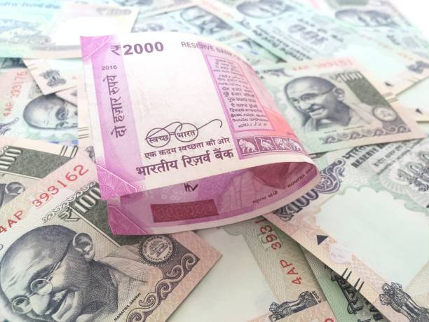istock 2000 indian currency in forground with 100 currency in background 827536928