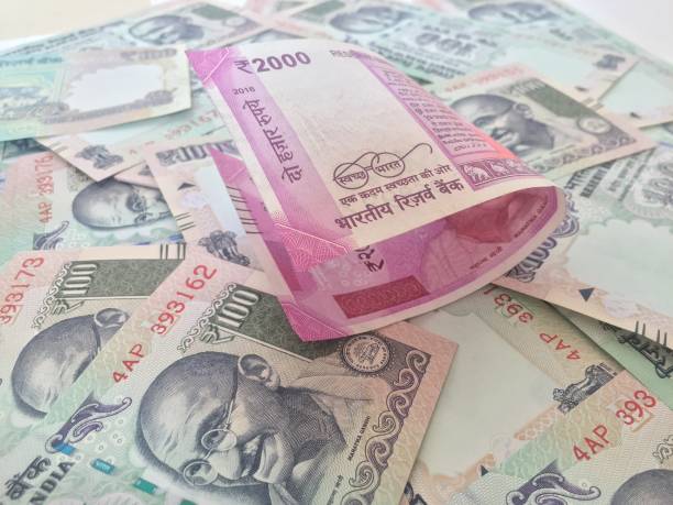 istock 2000 indian currency in forground with 100 currency in background 827537068