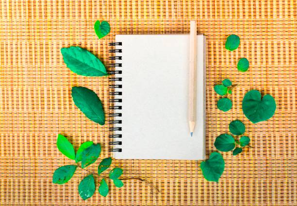 istock Notepad with pencil on wood board background. using wallpaper or background for education photo. Take note of the product for book with  paper. 827540534