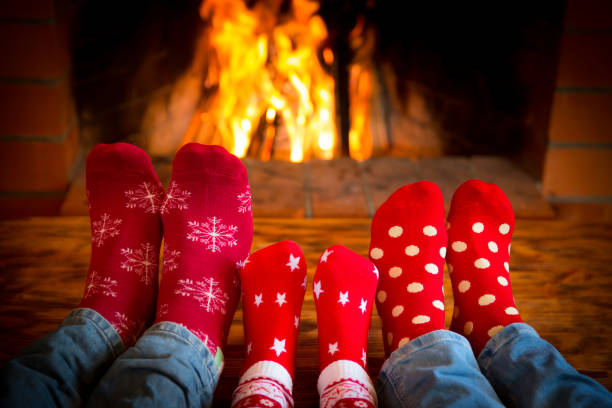 istock Family near fireplace 827544616