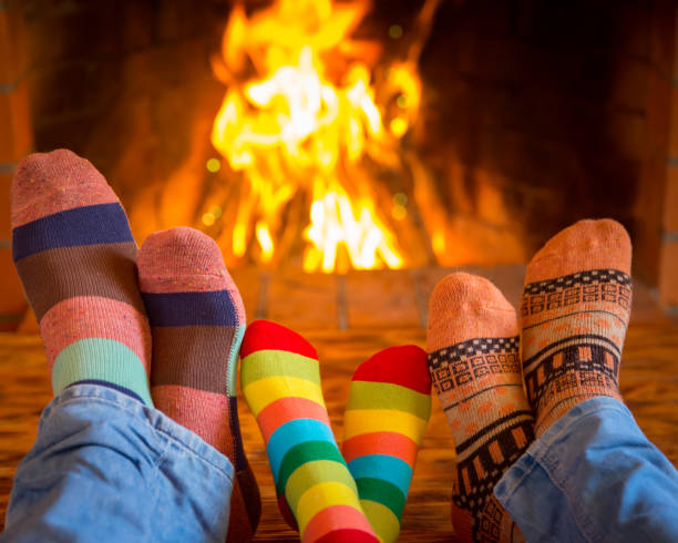 istock Family near fireplace 827544636