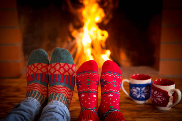 istock Couple near fireplace 827544682
