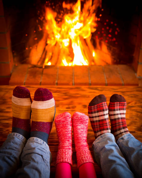 istock Family near fireplace 827544710