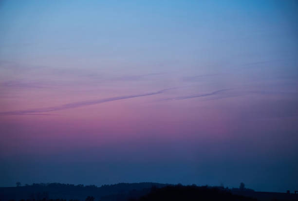 active Windmill for electric power in a colorful sunset sky background