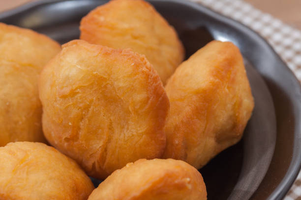 istock Chinese fried Dough bun on wooden plate 827545408