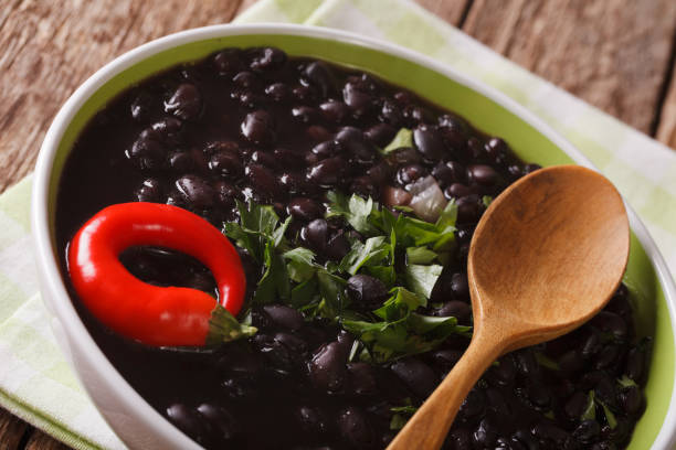 istock Vegetarian food: spicy black beans close up in a bowl. horizontal 827545446