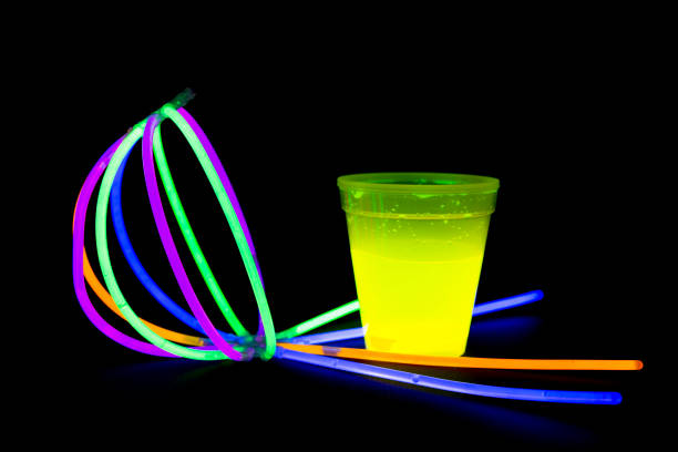istock Yellow colored fluorescent glass with glow sticks lights 827546236
