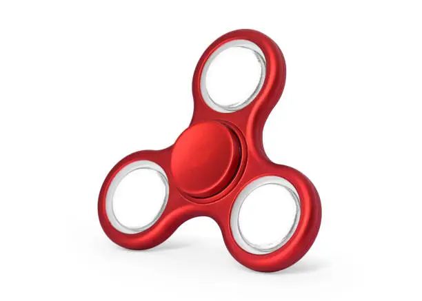 Photo of Red fidget spinner isolated on white background. Stress relieving toy. ( Clipping paths or cut out object for montage ) Can put text, image, and logo.