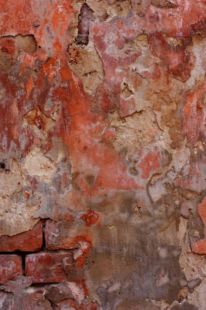 istock Old vintage red brick wall with cement seams texture background 827546472
