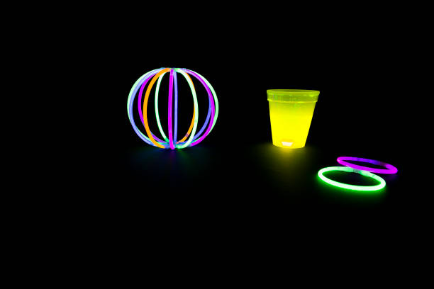 istock Yellow colored fluorescent glass with glow sticks lights 827547006