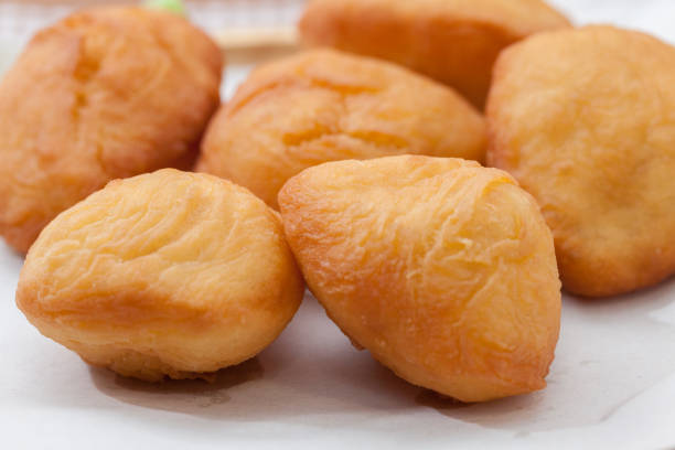 istock Chinese fried Dough bun on wooden plate 827549364