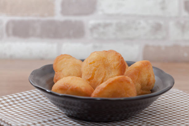 istock Chinese fried Dough bun on wooden plate 827549556