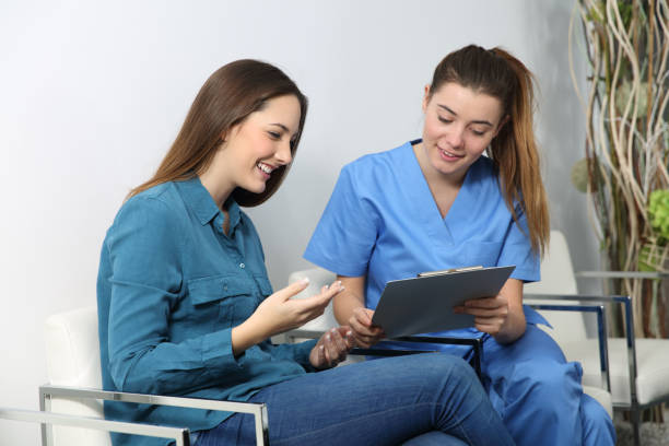 istock Nurse explaining medical procedure to a patient 827550312