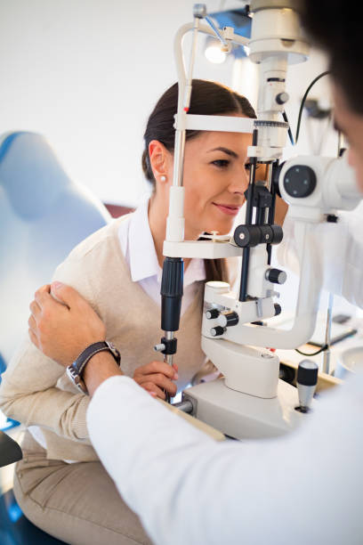 istock Female patient having eye examination 827550364