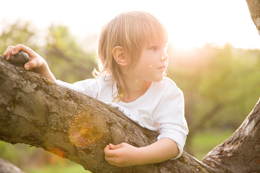 Argentinean 6 years-old boy portrait playing outside