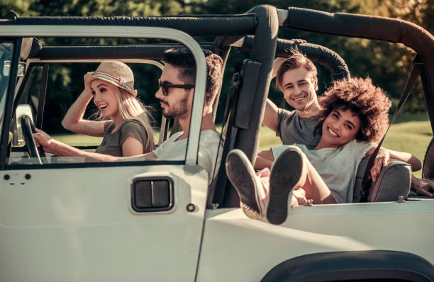 istock Friends travelling by car 827555546