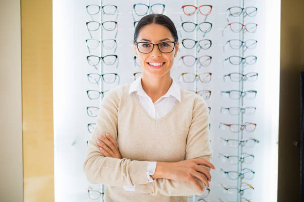 istock Woman wearing eyeglasses at the optical store 827558630