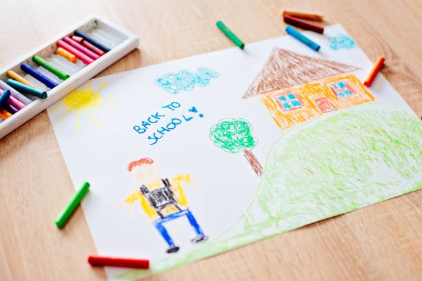 istock Childs pastel drawing of boy going to school. 827562088