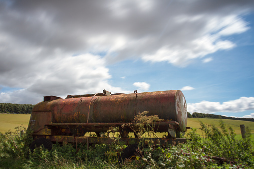 Old forgotten retired agricultural machinery rusting in the countryside