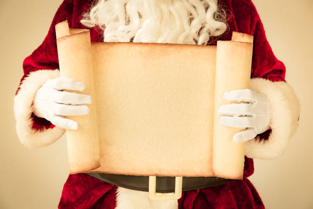 istock Santa Claus holding scroll paper blank 827563230