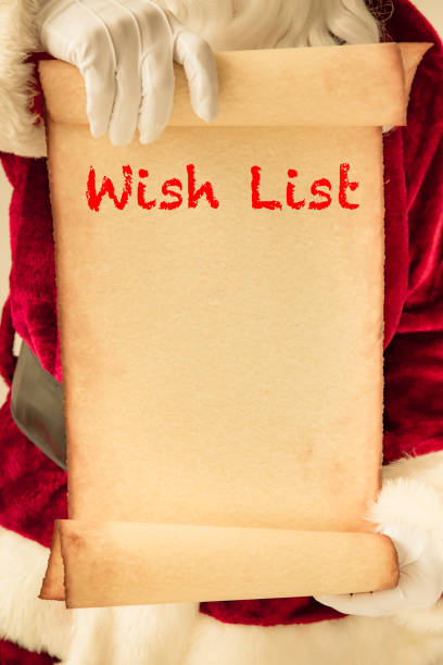 istock Santa Claus holding scroll paper blank 827563234