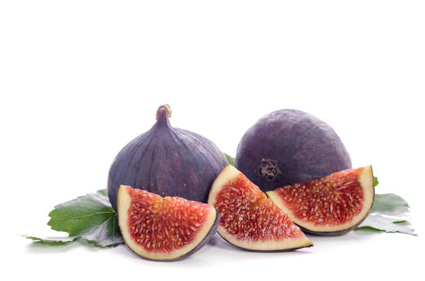 istock fruits of Fig tree (whole and part) with leaves isolated on white 827567352