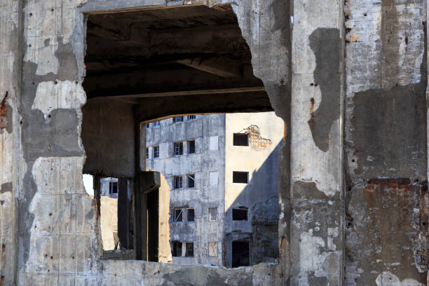 Ruins in Hashima Island, Japan Ruins in Hashima Island, Japan sites of japans meiji industrial revolution photos stock pictures, royalty-free photos & images