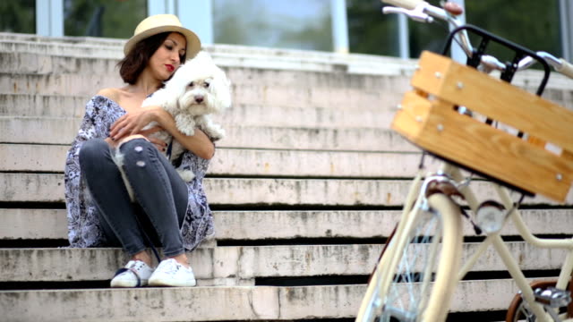 Touching Scene Of Hipster Girl Holding Fluffy Pet, Maltese Dog