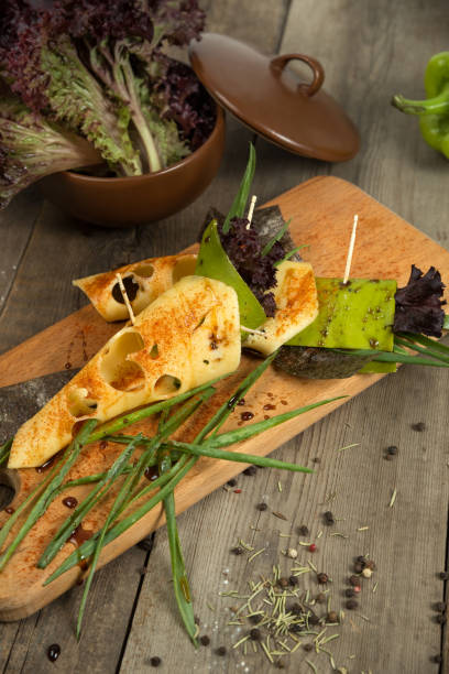 cheese snack with tofu, green pepper, nori leaves on a wooden tray - ravena imagens e fotografias de stock