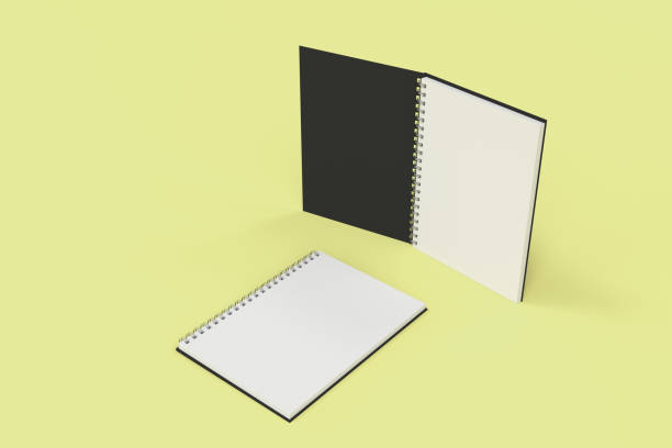 istock Two notebooks with spiral bound on yellow background 827572540