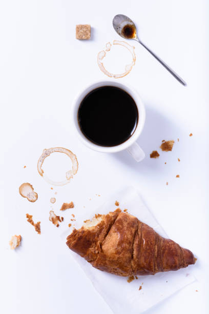 istock Coffee cup with croissant on white background, breakfast, coffee break. 827573058