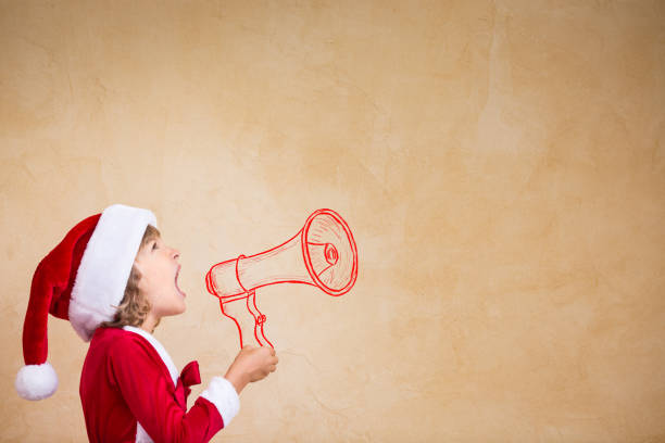 istock Funny Santa kid with drawn megaphone 827579086