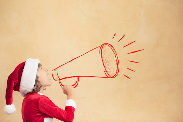 istock Funny Santa kid with drawn megaphone 827579090