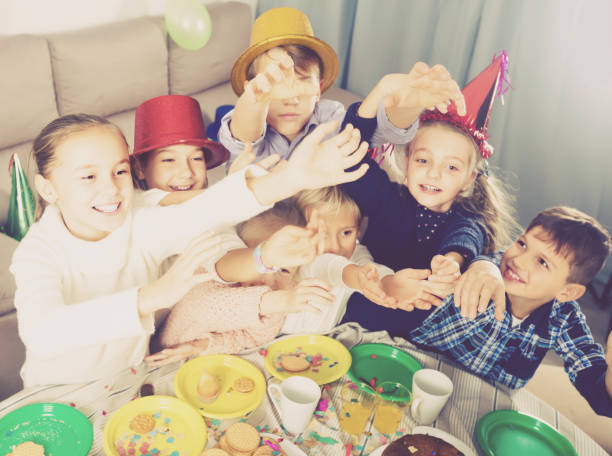 istock active kids having a good time at a birthday party 827579570
