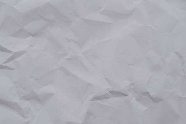 istock White crumpled paper background and texture 827580142