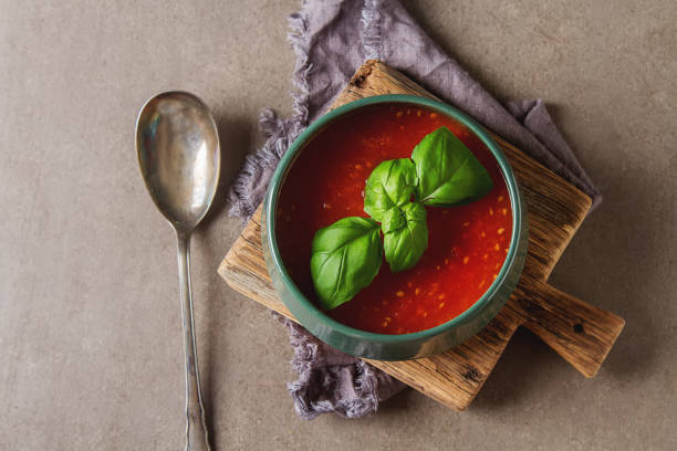 istock Traditional Italian tomato soup gazpacho with basil. Dark backgr 827580904