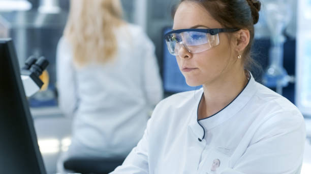 istock Medical Research Scientist Using Personal Computer. She Works in a Modern Bright Laboratory. 827581720