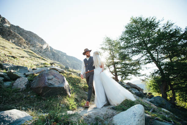 istock Wedding couple getting married in the mountains in Switzerland 827583504