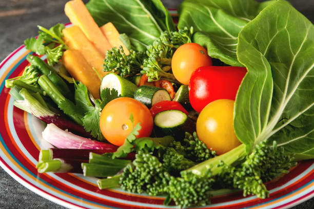 Dietary food. Green salad with melon, tomatoes, peppers, onions,