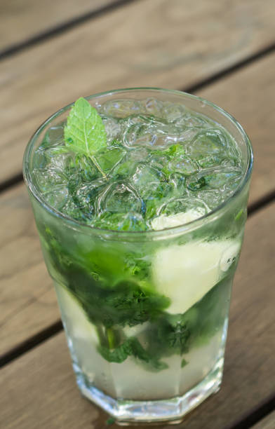 istock Mojito on a wooden table, fresh drink 827587874