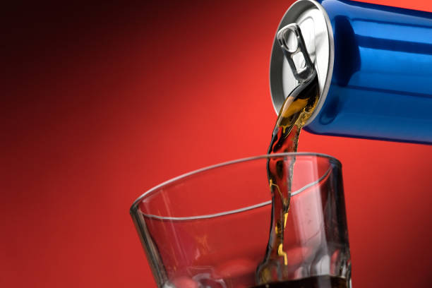 Pouring a soft drink in a glass