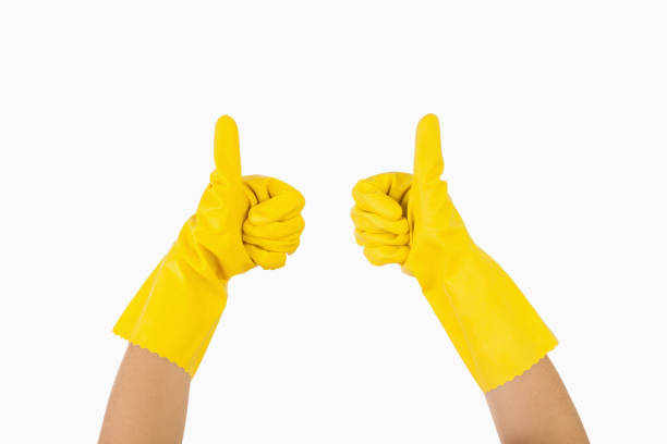 istock Female hands in gloves showing thumbs up 827588270