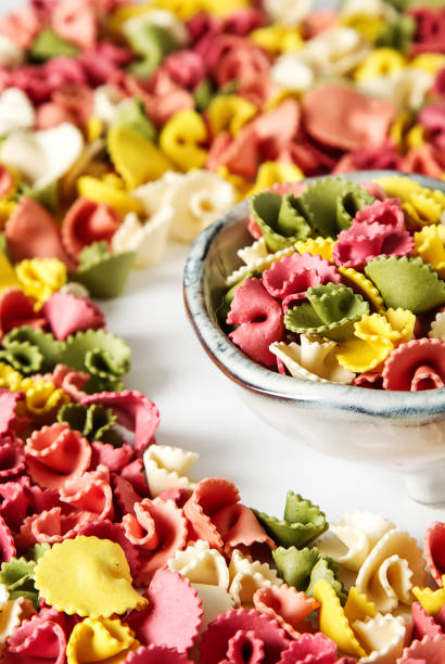 istock Multicolored Italian pasta. Delicious dinner for children. Pasta 827588986