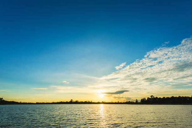 istock Beautiful sunset landscape with blue sky over lake 827595814