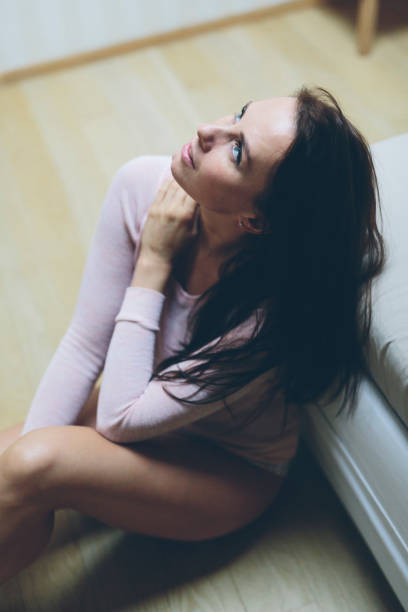 istock Pensive woman at home 827595822