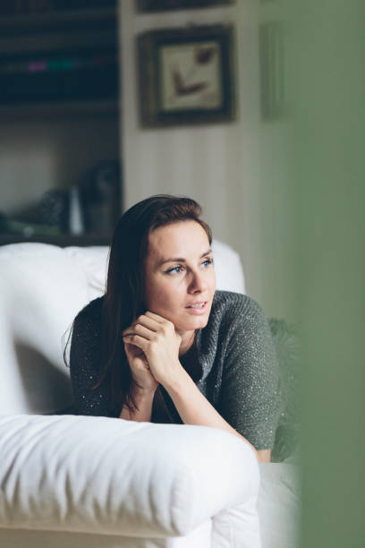 istock Woman relaxing on the sofa at home 827596010
