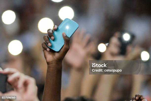 Mobile In The Hand Of Spectators Stock Photo - Download Image Now - Mobile Phone, Lantern, Performance