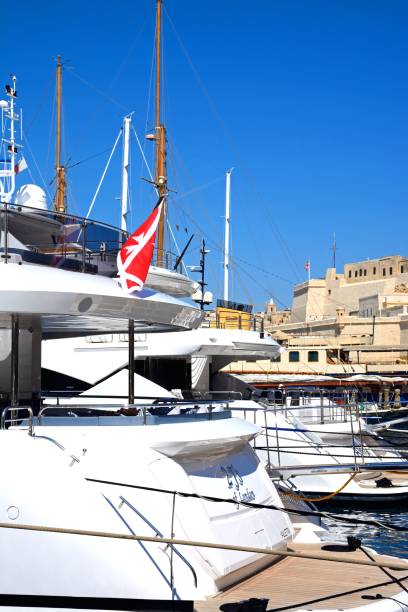 Luxury yacht in Vittoriosa marina, Malta. Luxury yacht moored in the marina with Fort St Angelo to the rear, Vittoriosa, Malta, Europe. coconut crab stock pictures, royalty-free photos & images